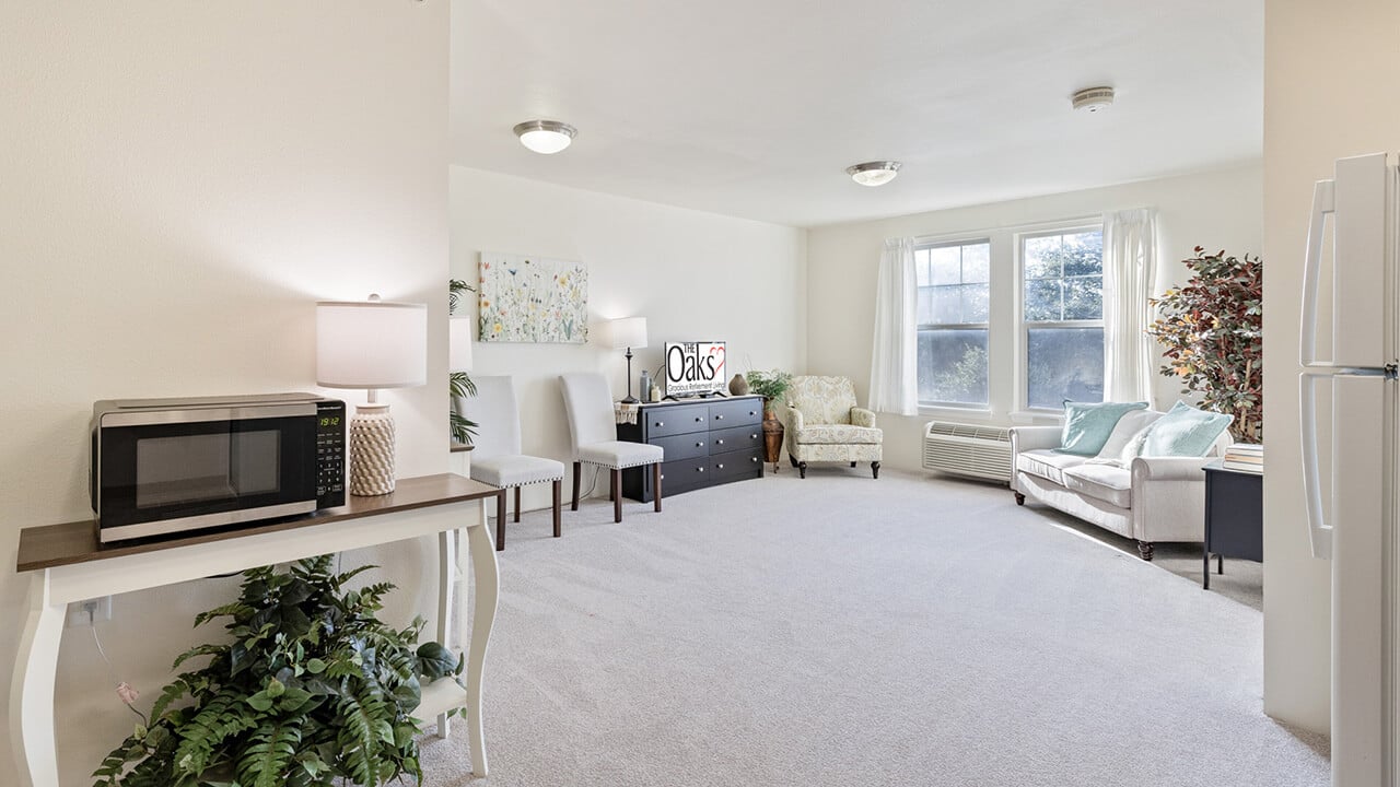 A living room in a The Oaks apartment
